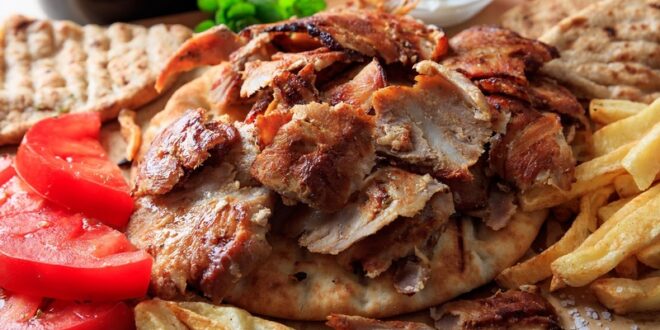 Greek,Gyros,Dish,On,A,Wooden,Background
